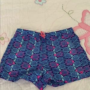 Vibrant pink and blue fish print swim shorts